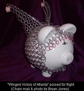 Piggy bank poised for Flight (Chain mail & photo by Bryan Jones) Piggy bank poised for Flight (Chain mail & photo by Bryan Jones)